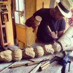 Mauritian artist, sculpture of face, dead wooden tree, carving, Mauritius artisan, Local talents, Island skills, professional sculptor