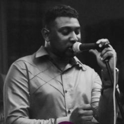 Michael Bienvenue aka Mikool, Black and white photo, closed eyes, artis lokal, maurtian man, singer and composer